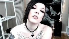 Goth girl mmetalcat massages her big tits