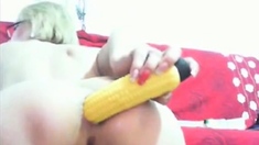 Webcam Milf sticks a corn shaped dildo in her gaping ass!